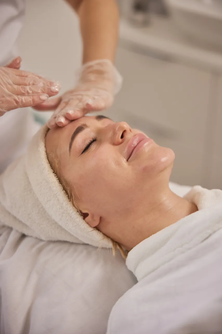 A patient undergoing a facial treatment at a skin clinic