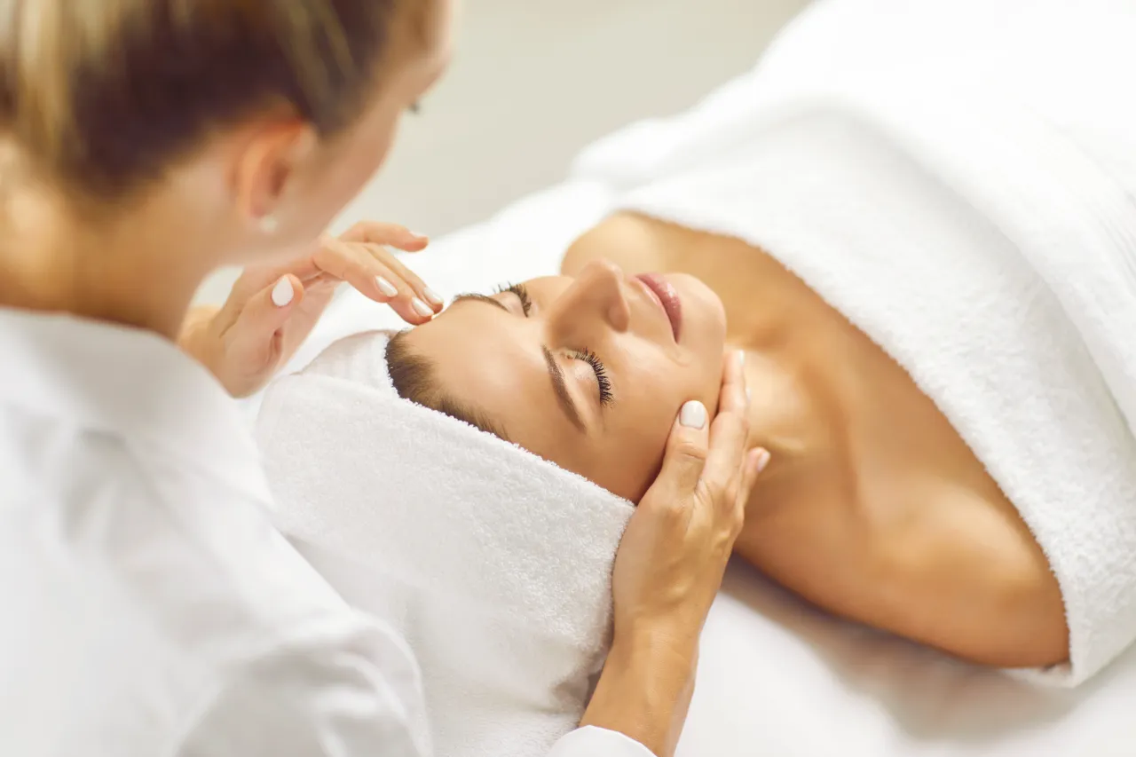 A woman receiving skin consultation